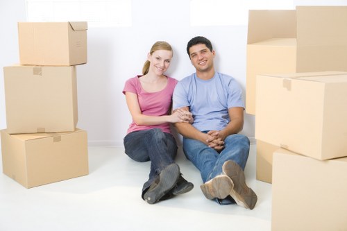 Removal van and moving boxes for a New Malden home move