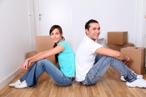 Moving boxes and household items ready for collection in New Malden