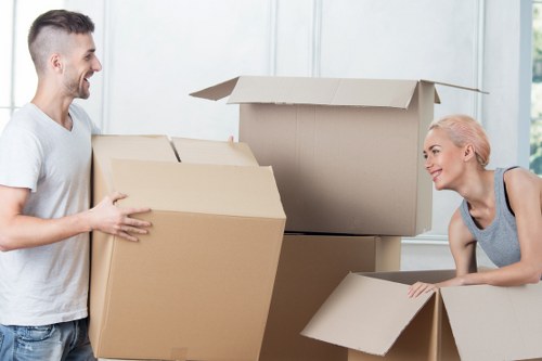 Movers handling furniture carefully during a New Malden relocation