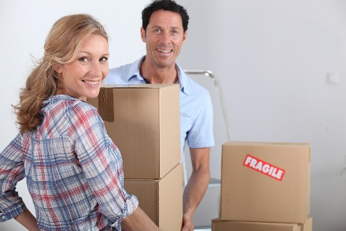 Team handling office furniture and equipment during a New Malden move